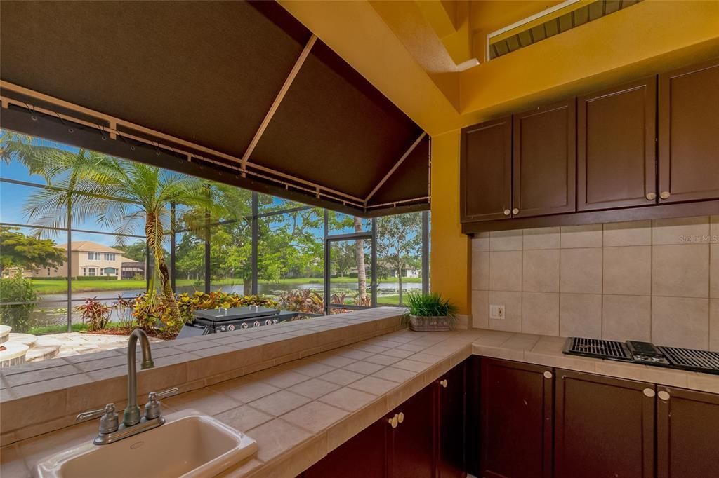 Outdoor kitchen by pool.