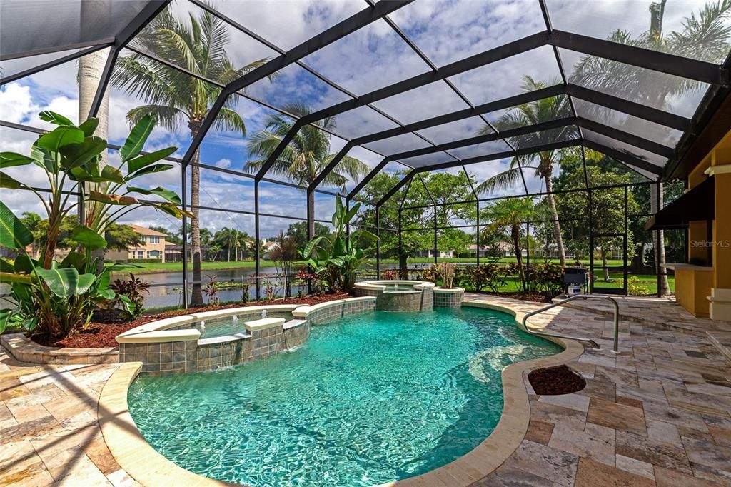 Tropical getaway pool overlooking the tranquil lake.