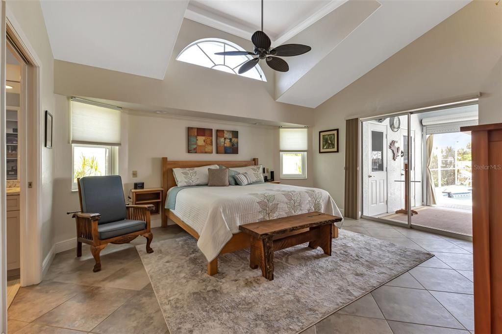 Master bedroom with vaulted tray ceiling, and sliders to lanai.
