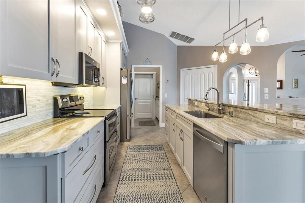 Kitchen features soft close draws & doors, beautiful quartz countertop and tasteful backsplash.