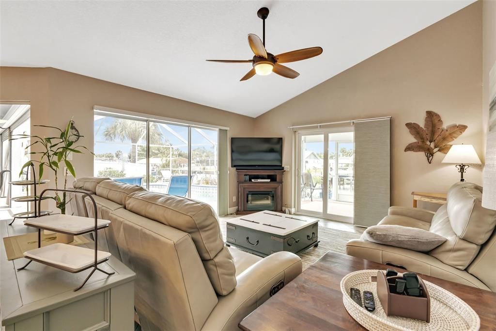 Family room with 2 set of sliders to lanai and pool.