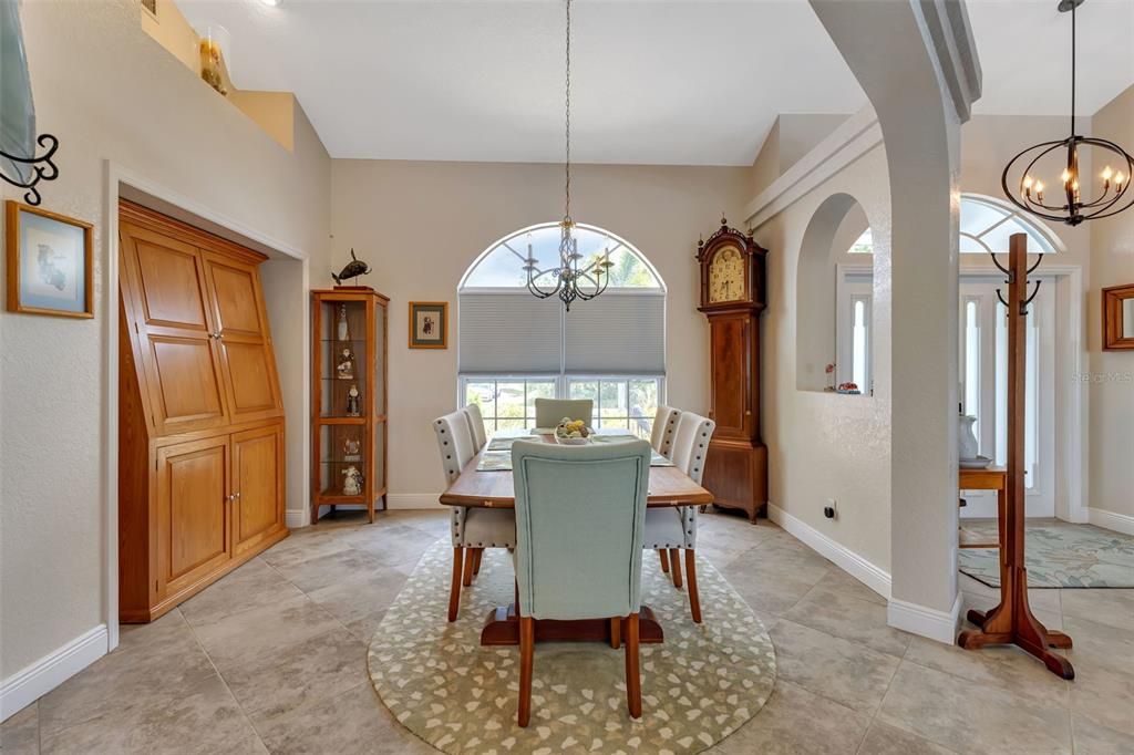 Formal dining room with built in planter shelves and a wall nook.