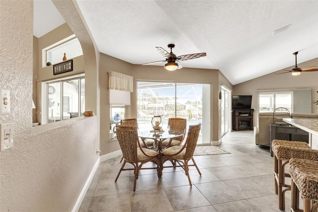 Breakfast nook in kitchen with sliders to lanai.