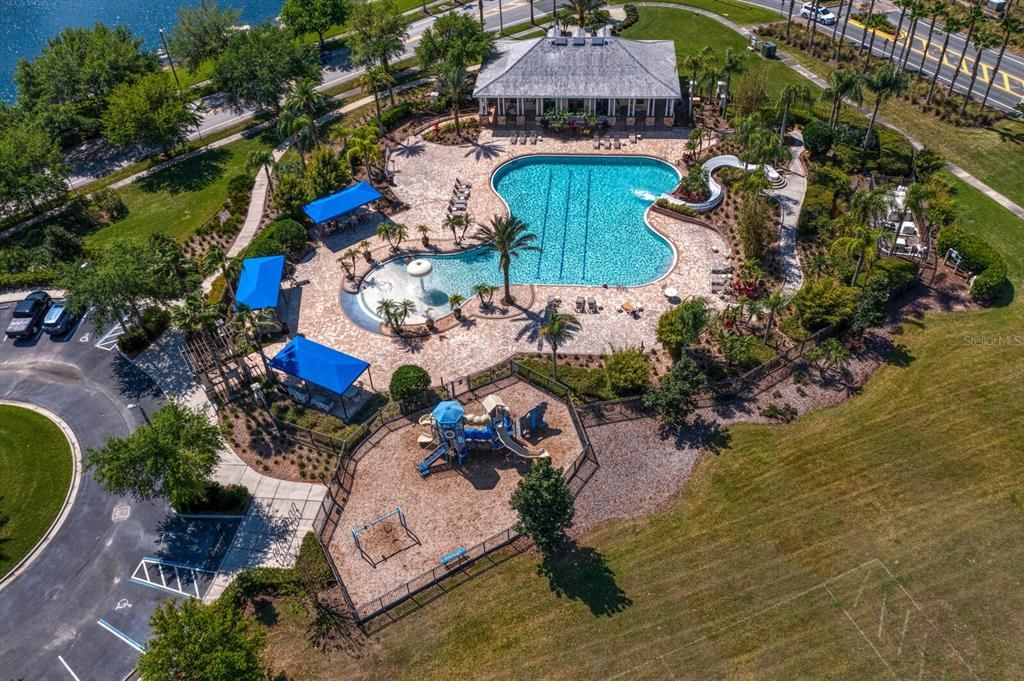 Multiple cabanas and lounge chairs at the community pool