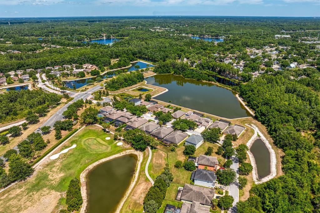 The Woodside community is surrounded by multiple ponds, trees and a golf course