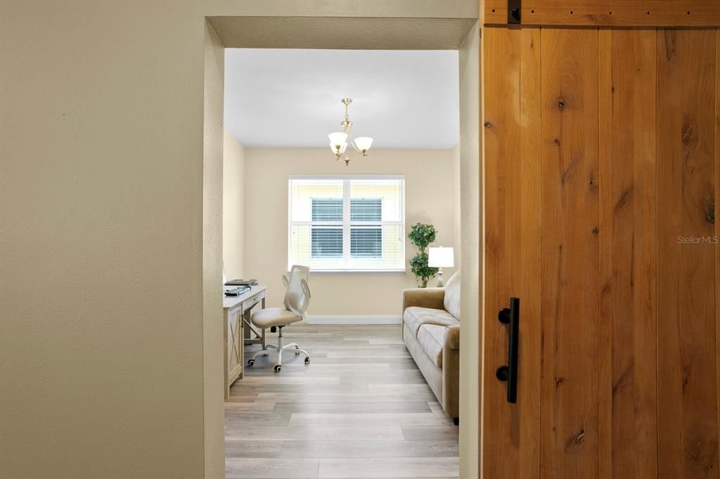 Private home office with custom barn door