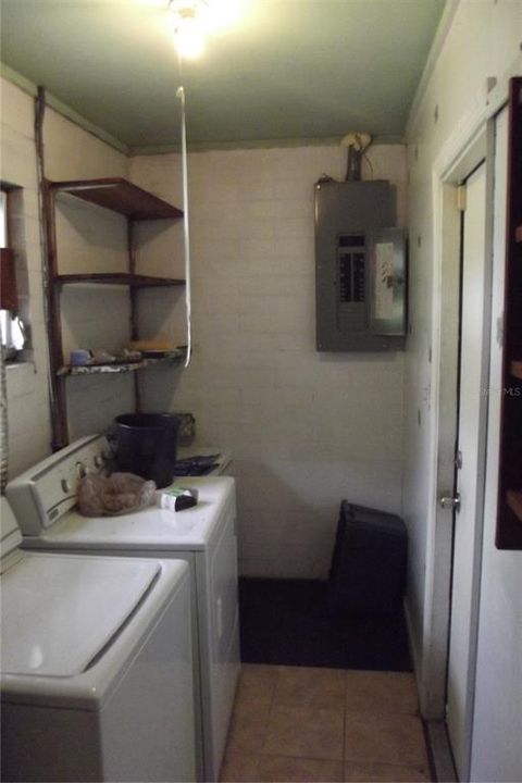 Utility Room with doorway to carport