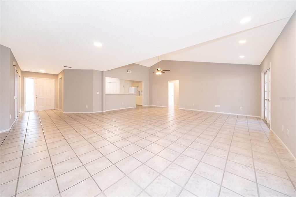 Dining/Living Rooms facing Foyer and Eat In Kitchen with Breakfast Bar