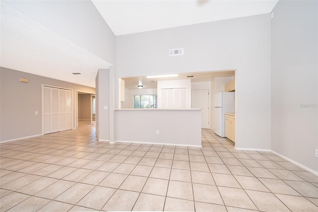 Living Room Facing Breakfast Bar/Eat In Kitchen/Foyer and office/4th Bedroom on left