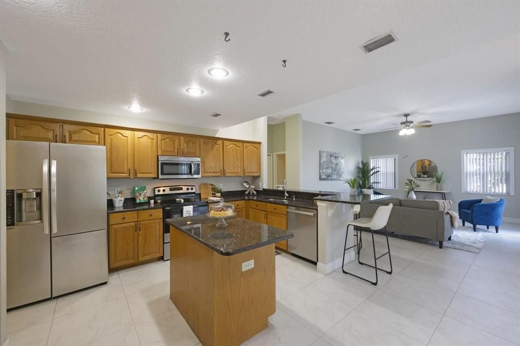 The kitchen is every open and has the extra work area on the island pictured here.