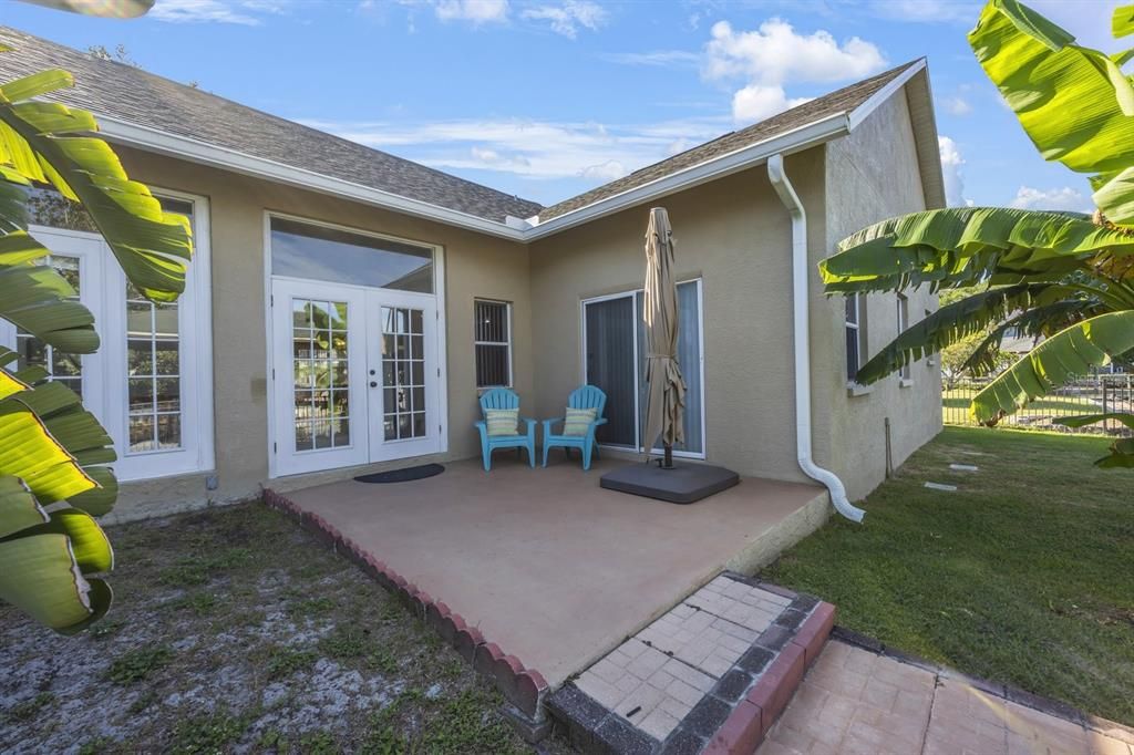 Rear patio with walkway to the lift and dock.