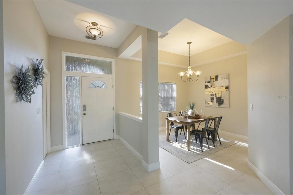 Looking into the foyer and formal dining area.