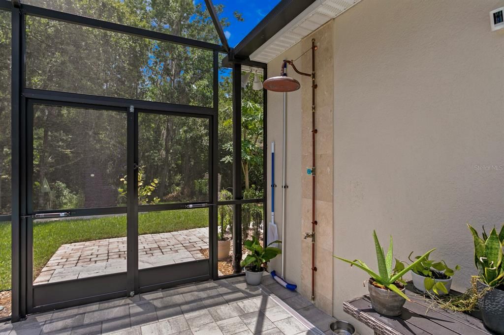 Rinse off under the outdoor shower rain head