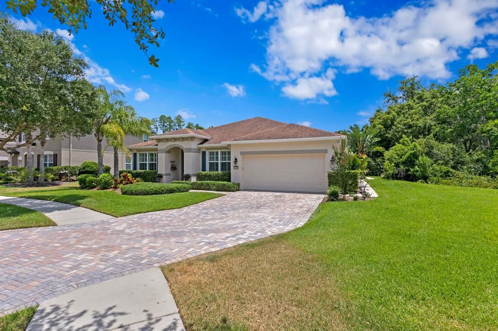 The oversized paver driveway provides plenty of room for parking