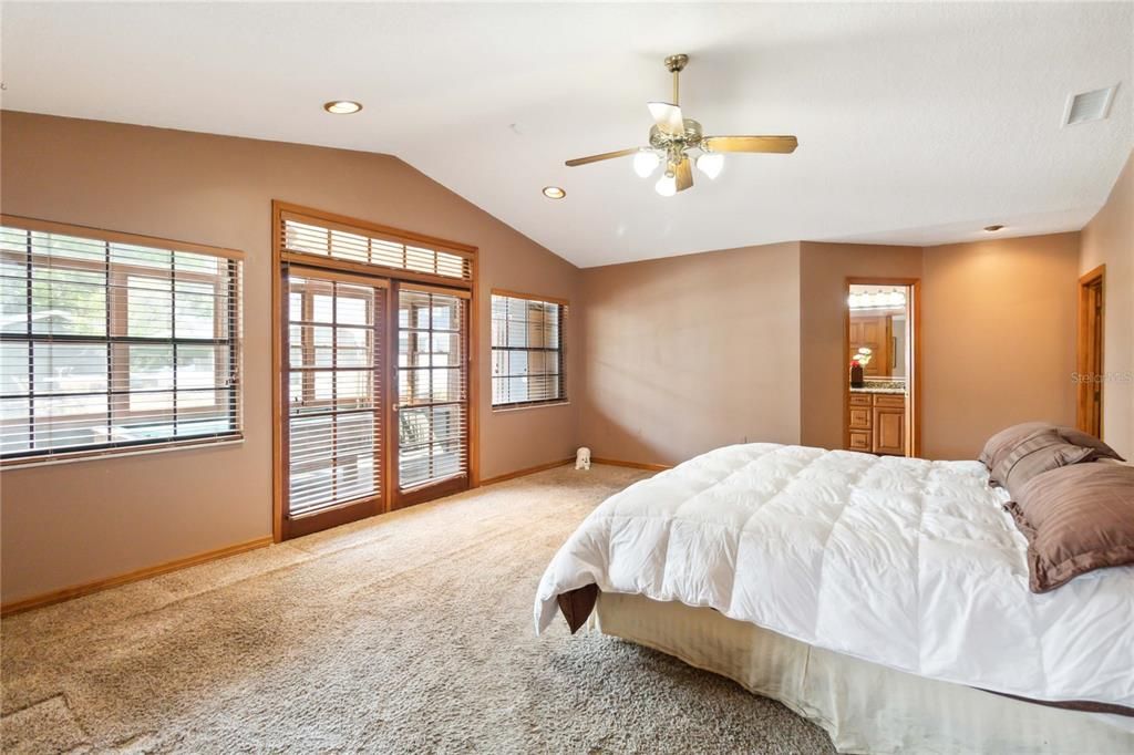 Large Primary Bedroom with French Doors leading to the Florida Room