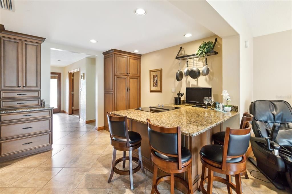 Cooktop and seating in kitchen