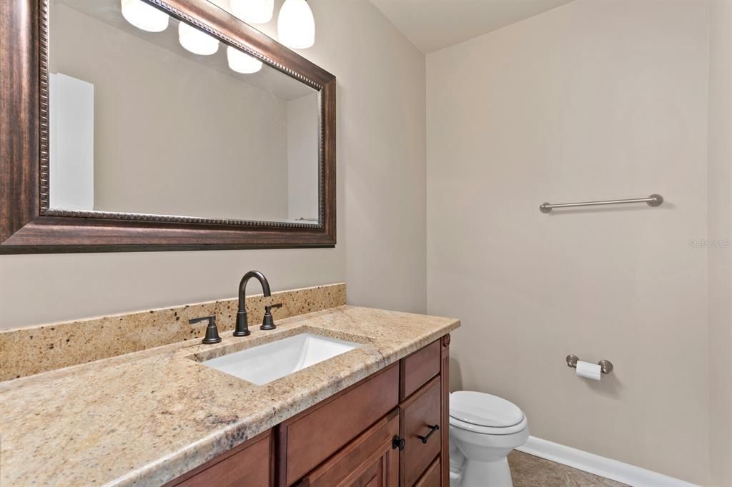 The first floor half bath has just been remodeled and includes granite counters