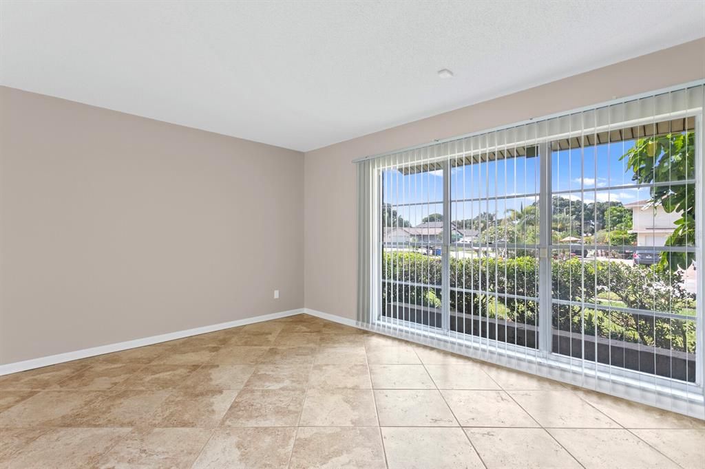 Oversized ceramic tiles on the diagonal are in the living and dining rooms