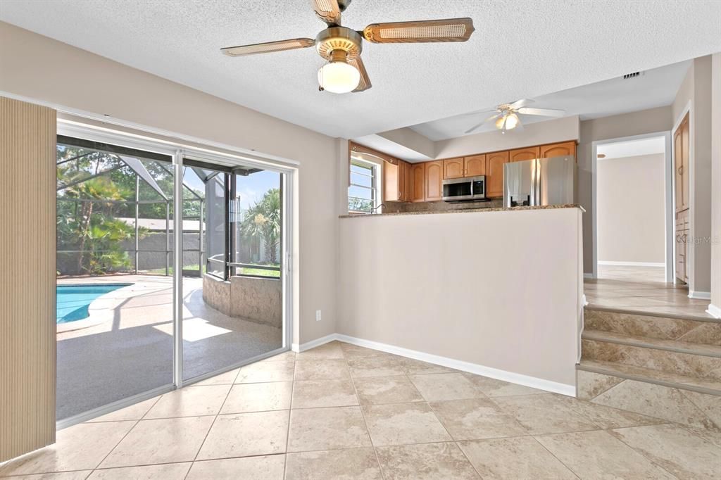 Sliders from the family room out towards the private pool