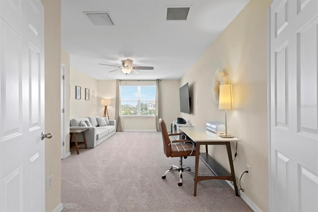 French doors lead into the huge 2nd bedroom