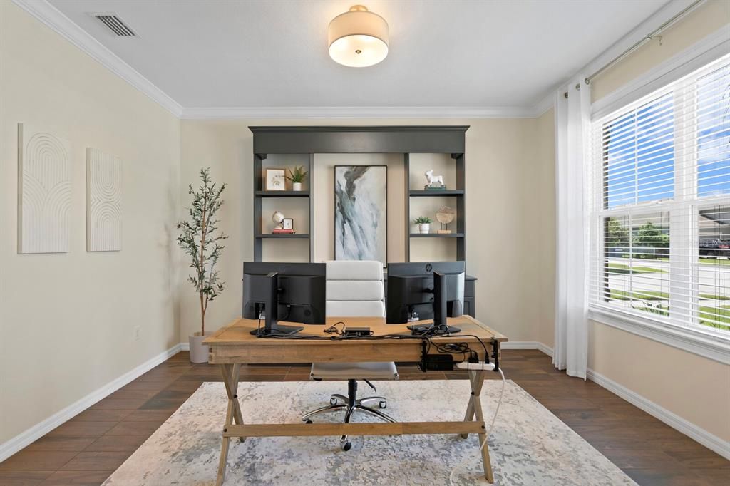 Tranquil home office with custom built-in entertainment center & crown molding