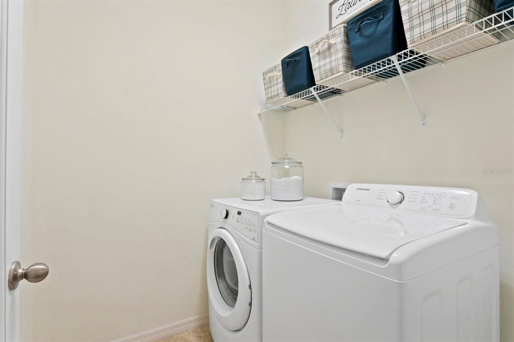 Spacious laundry room with an included washer/dryer