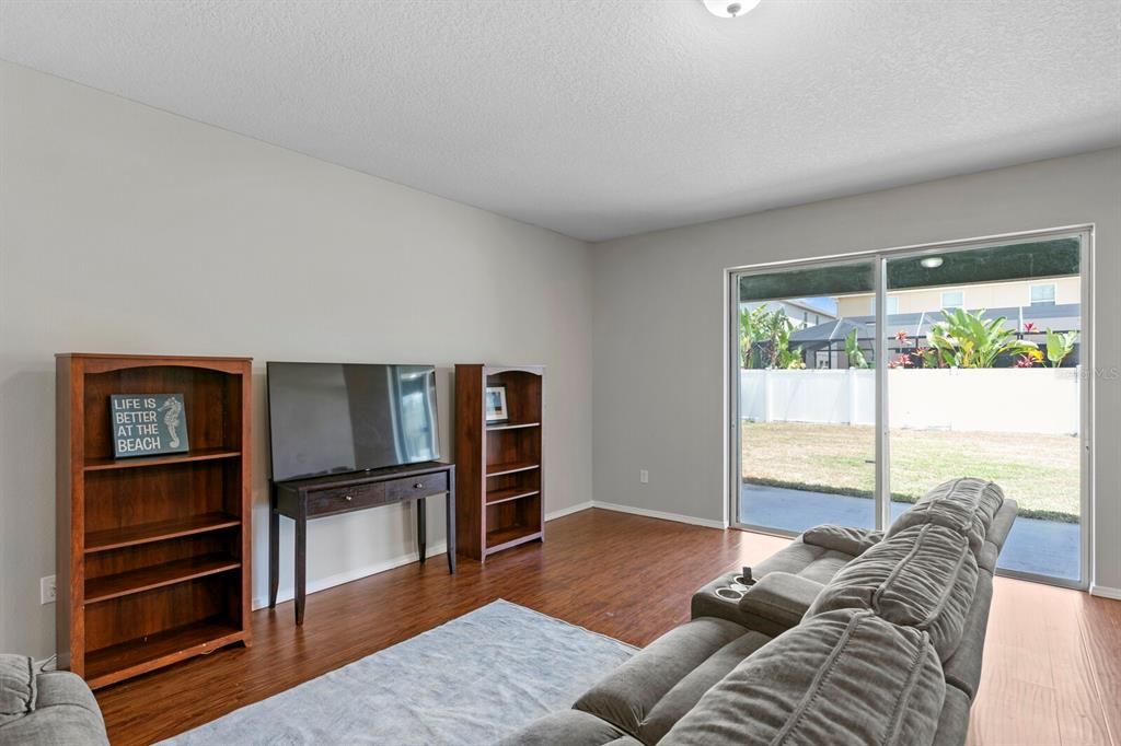 Family room with sliders that open to covered lanai