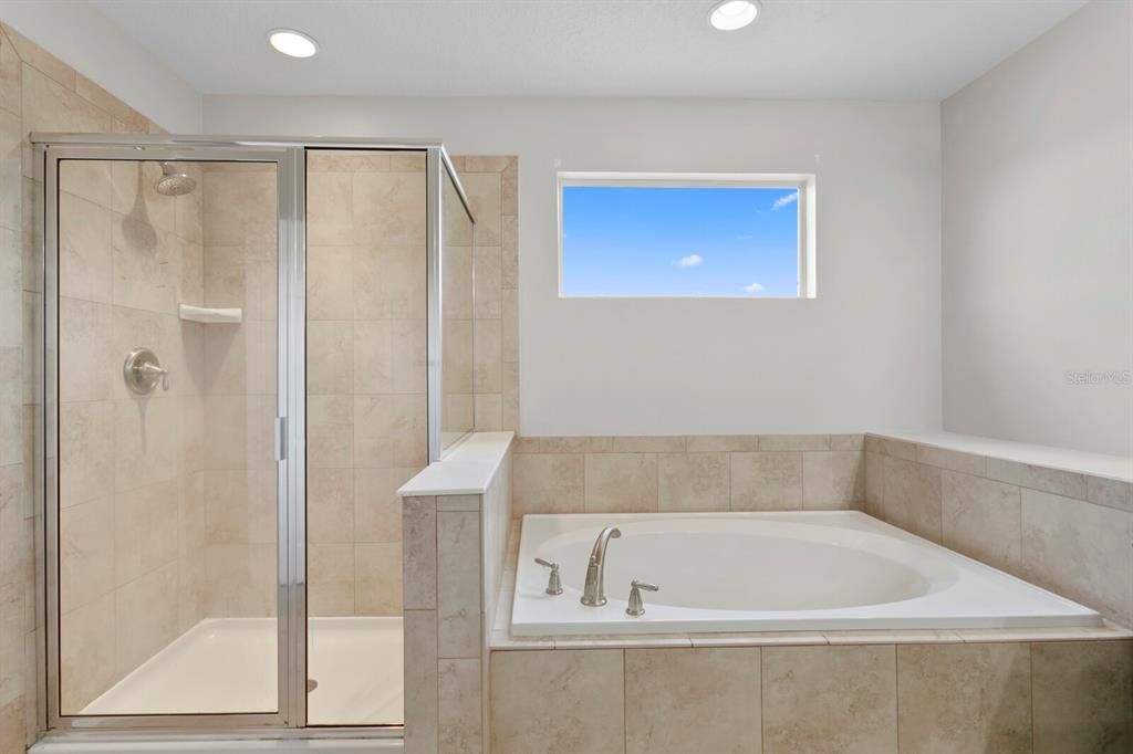 Primary bath with garden tub and walk-in shower