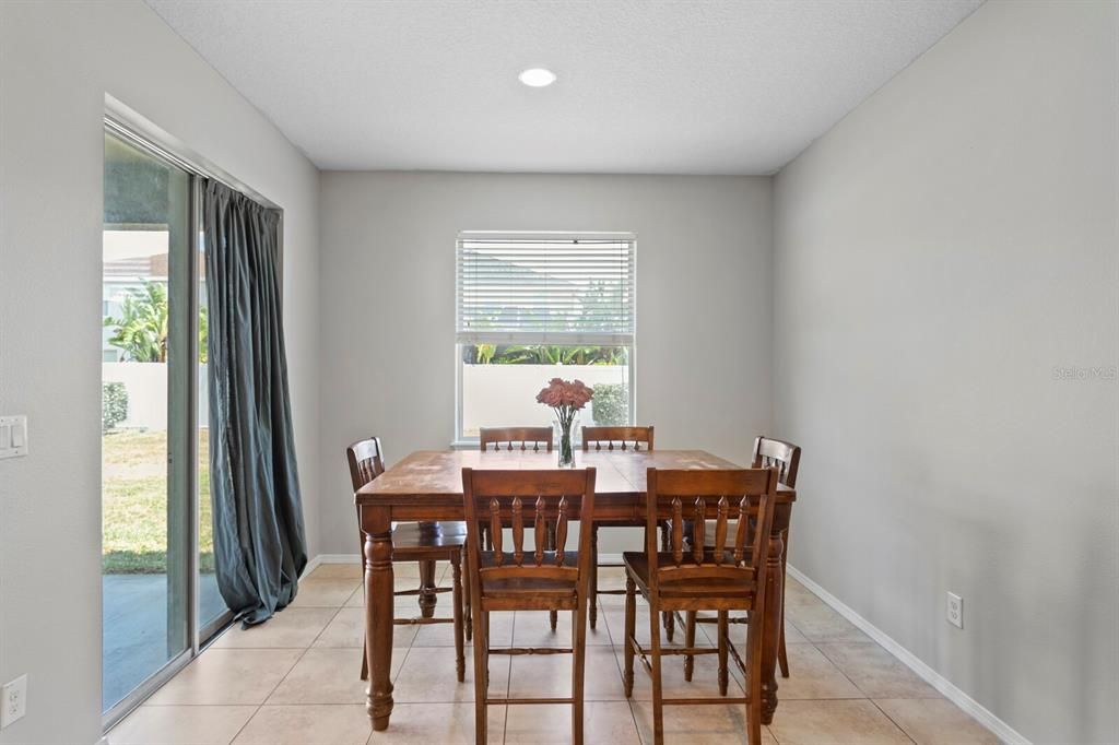 Casual dining area with sliders to covered lanai