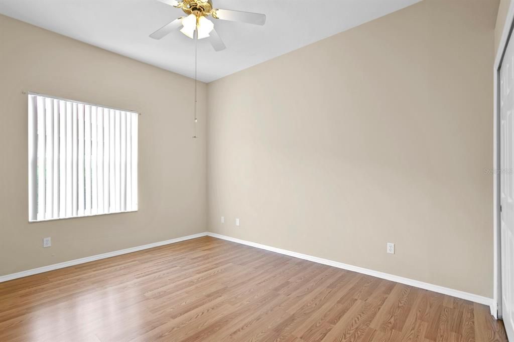 The 3rd bedroom has laminate floors and neutral paint