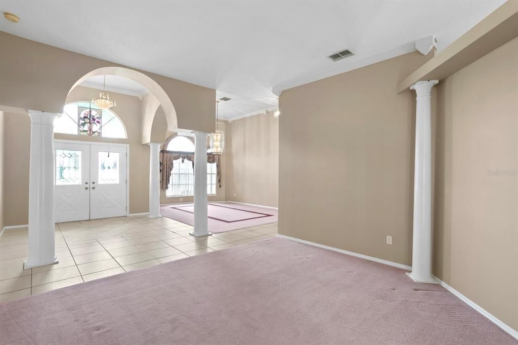 Views from the formal living room looking towards the foyer and formal dining room