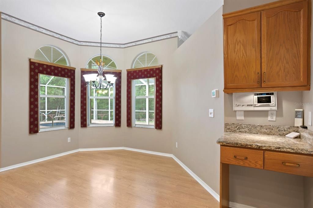 Spacious casual dining area in the dinette and separate workstation