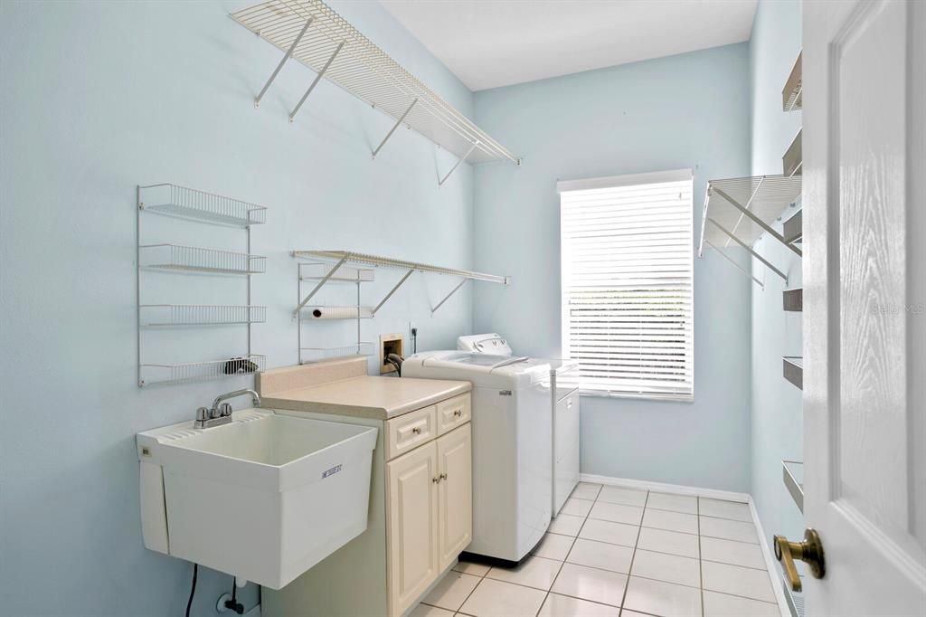 The oversized laundry room includes the washer & dryer