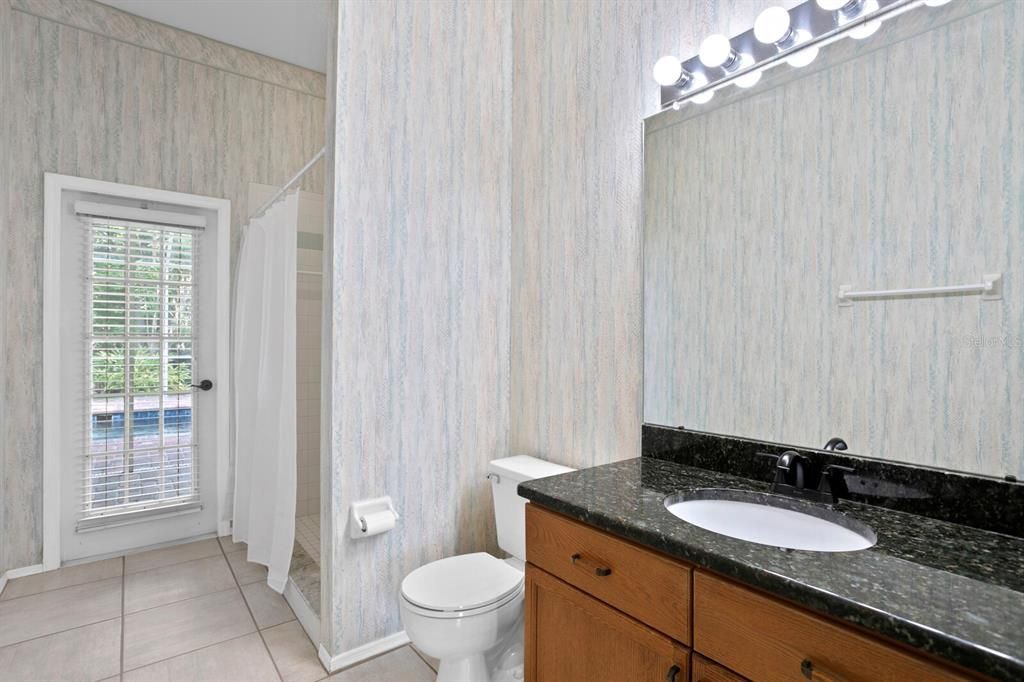 The 3rd full bath has granite counters, a walk-in shower and direct access as a pool bath