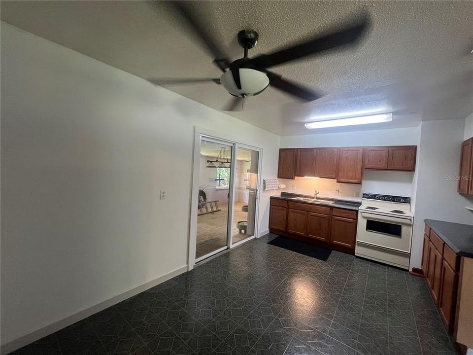 Sliding doors in kitchen leading to addition