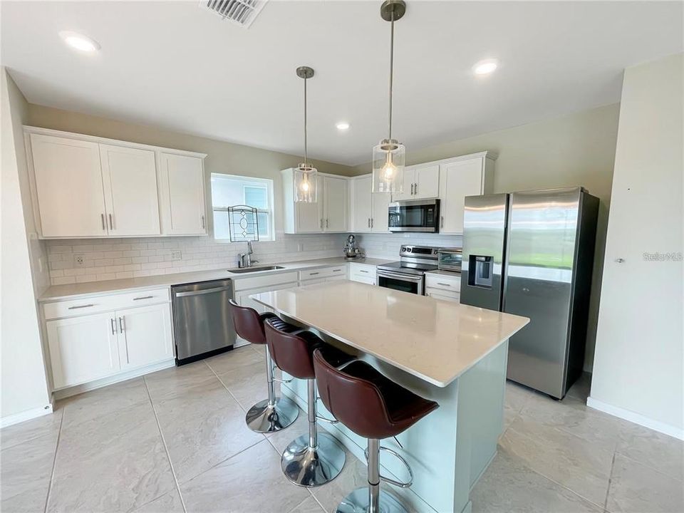 Large Island, plenty of cabinet space, and a pantry in kitchen.