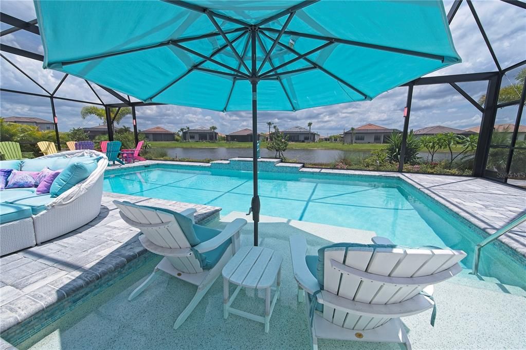 Under an umbrella in the pool to cool off