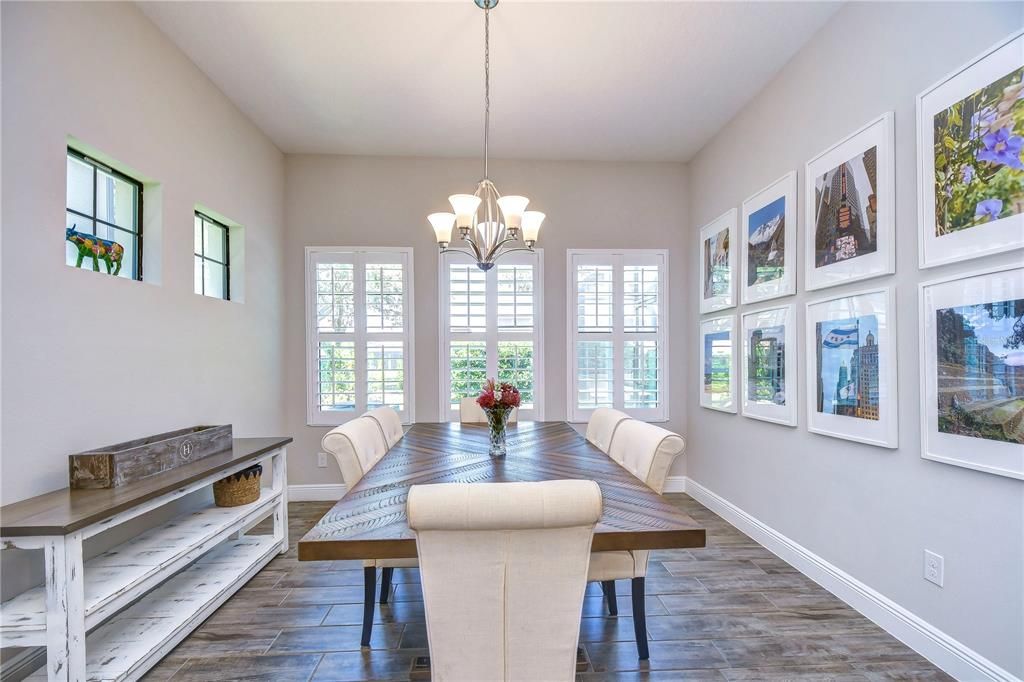 Bright & open dining space with plantation shutters!