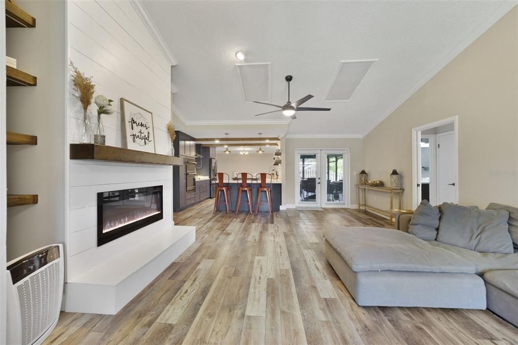 You have your choice of formal or casual dining spaces and the generous living room features an ELECTRIC FIREPLACE accented by a shiplap wall, mantle and open shelving on either side to display your favorite treasures.