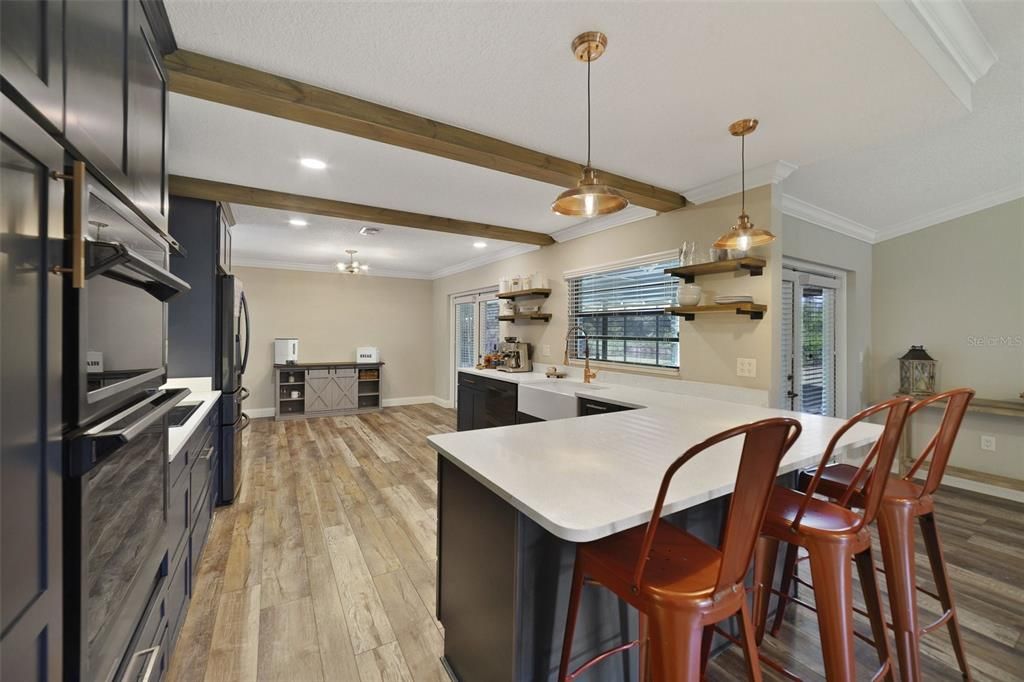 The kitchen was renovated and upgraded with the home chef in mind offering modern design choices paired with WOOD BEAMS/WOOD ACCENTS and stylish finishes/fixtures for endless character.