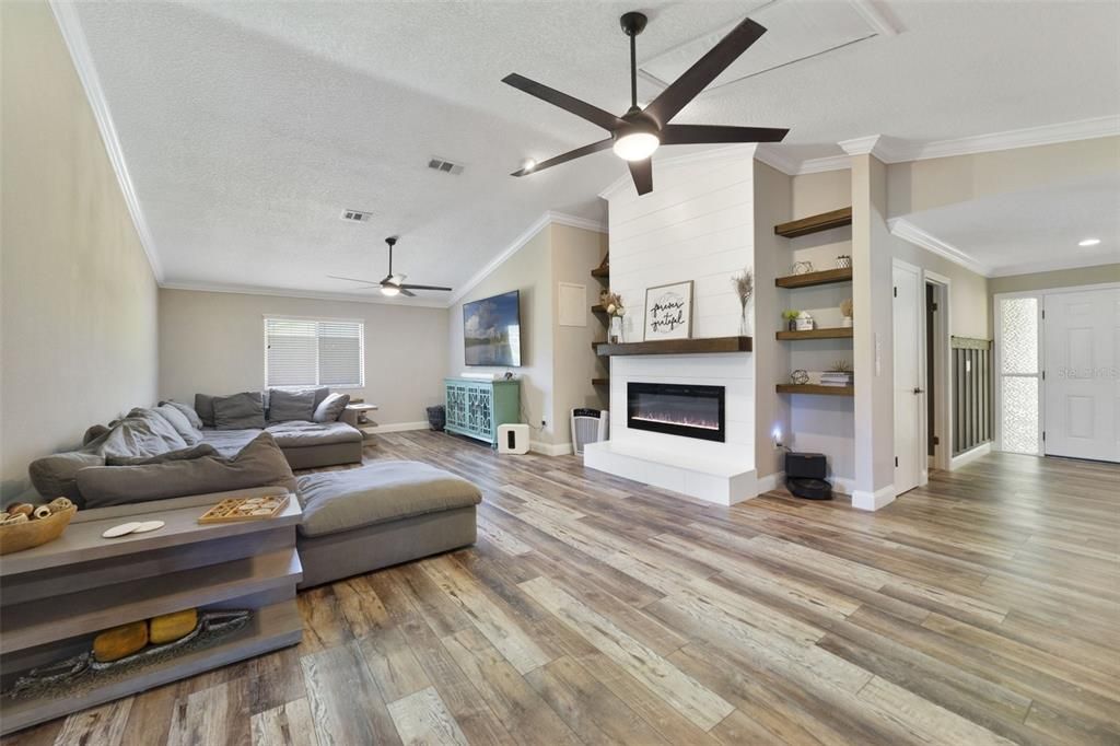 There are LUXURY VINYL PLANK WOOD FLOORS throughout for easy maintenance blending seamlessly with the many updates.