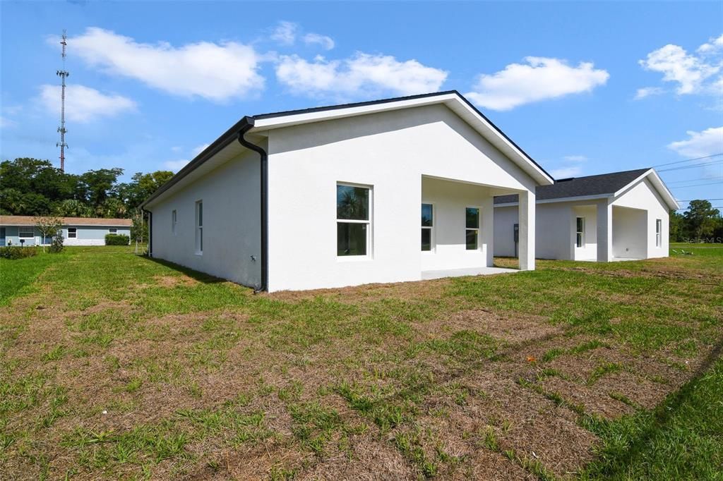 The COVERED LANAI overlooks a nice sized yard ready for you to make it your own.