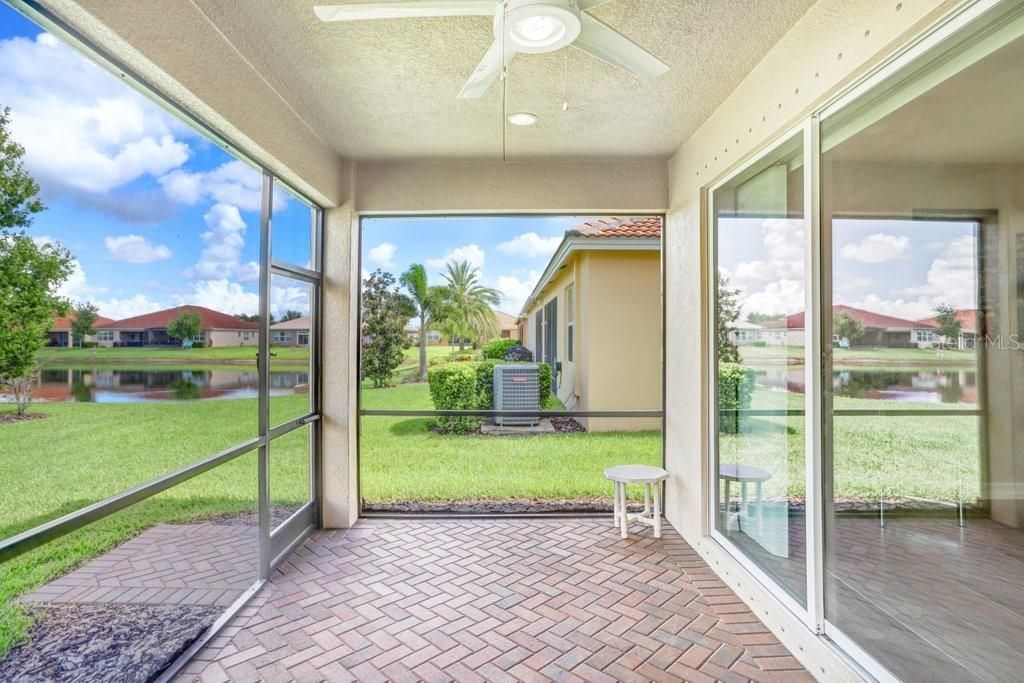 The back porch is screened-in and features a lighted ceiling fan, plus 3 extra lights.  The pocket slider is an oversized 8' tall!