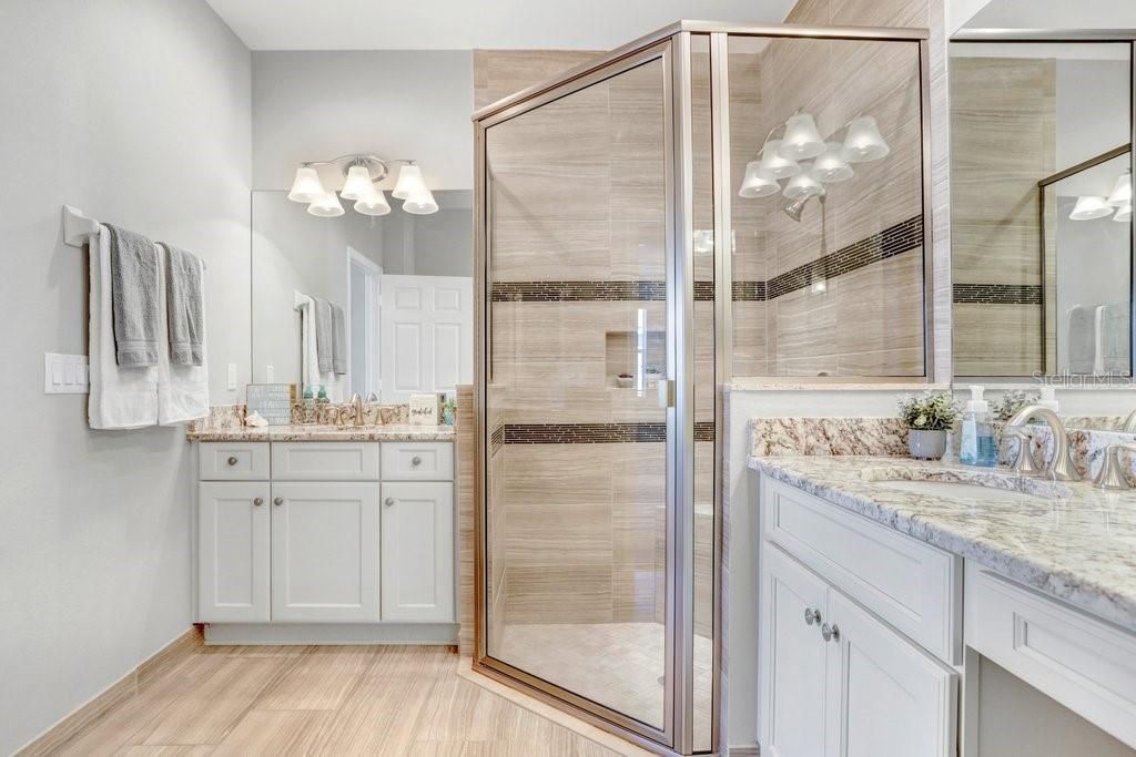 The Master Ensuite is luxurious!  You'll love having 2 sinks, a split vanity, lots of storage space and counter space, a private toilet room, a large linen closet, AND a WALK-IN SHOWER with a BENCH SEAT!