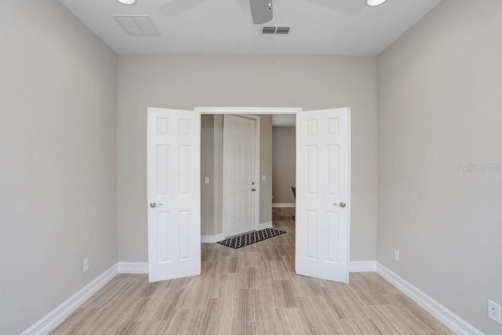 The Den/Office has a double french door entry and a lighted ceiling fan.