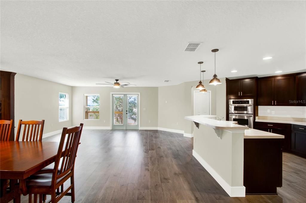 Open layout of living room, dining room and kitchen