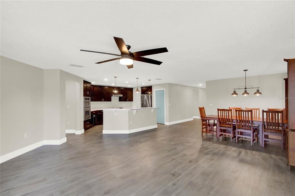 Open layout of living room, dining room and kitchen