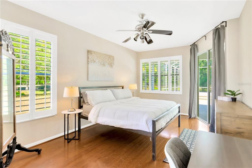 Primary bedroom overlooking the pool