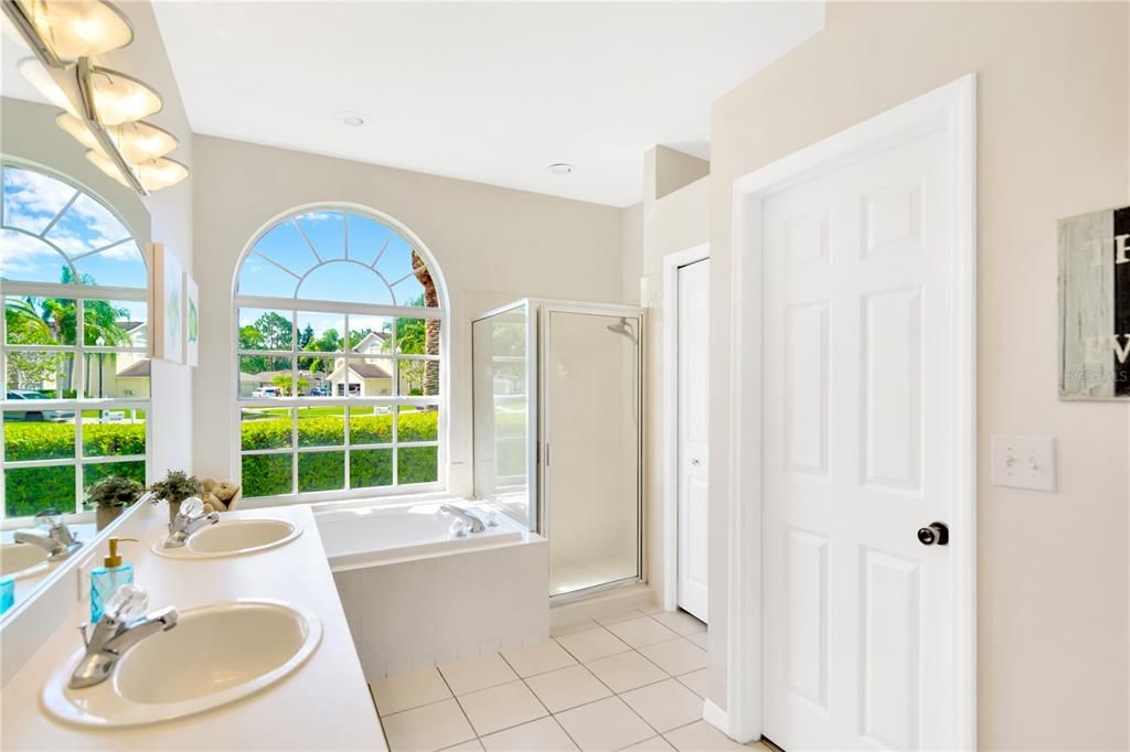 Primary bathroom with dual sinks and garden tub