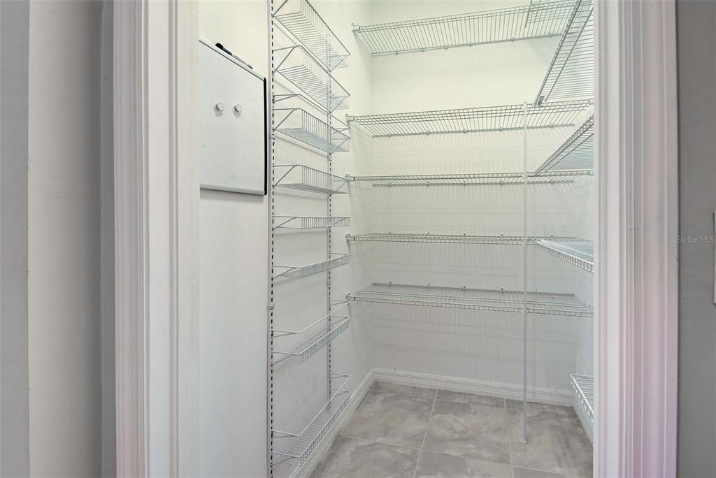 In addition to the ample cabinet space in the kitchen, there is also a walk in pantry for additional storage in the Butler's Pantry.